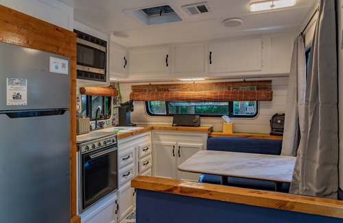 Littleton Cabin | Cozy camp cabin & RV with fire pit, outdoor dining, games, kayaks and more!