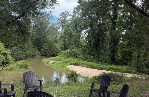 Fluker Cabin | Cozy Camp w/fire pit, grill and waterfront view of river. Pet Friendly! Wifi!
