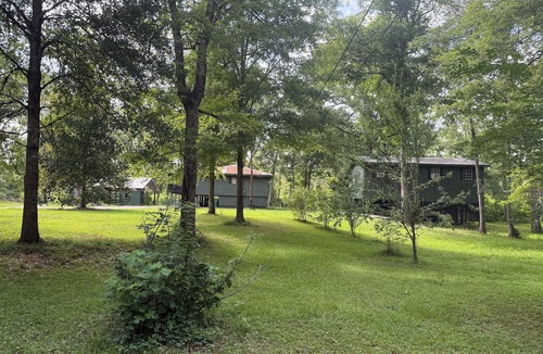 Fluker Cabin | Cozy Camp w/fire pit, grill and waterfront view of river. Pet Friendly! Wifi!