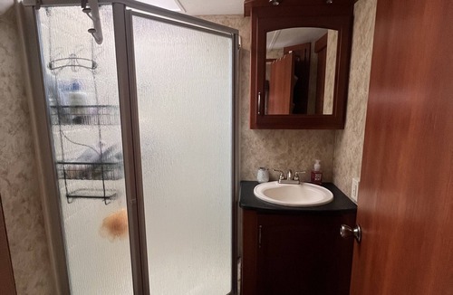 Charlotte House | Cozy camper trailer with great views of the sky. Fire pit great for entertaining