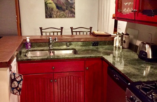Taos Condo | Cozy Casa Carmelita features a Brilliant Kiva Fireplace, Unique Patio & Hot Tub!