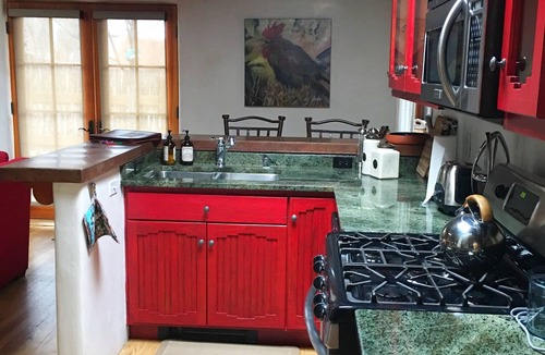 Taos Condo | Cozy Casa Carmelita features a Brilliant Kiva Fireplace, Unique Patio & Hot Tub!