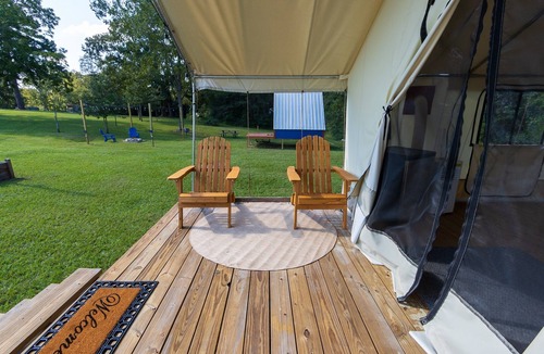 Coldspring RV Rental | Cozy Forest Retreat: Snug Glamping by the Fire Pit
