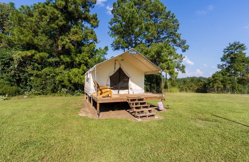 Coldspring RV Rental | Cozy Forest Retreat: Snug Glamping by the Fire Pit