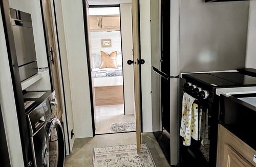 Freetown RV Rental | Cozy glamper with scenic pond in Brownstown Indiana