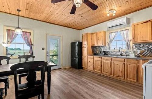 Wolfe City House | Cozy Glamping Retreat with Outdoor Shower & Fire Pit near Wolfe City, Texas