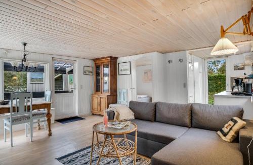 Logstor House | Cozy Holiday Home With Terrace And Wood-Burning Stove Close To The Water