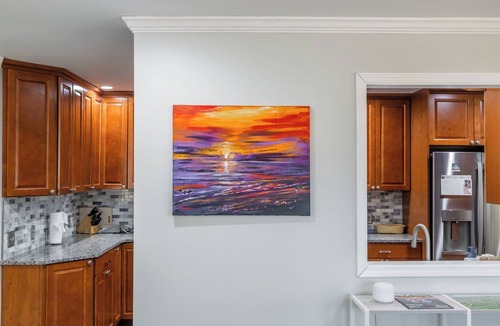 Radford House | Cozy home with a modern kitchen, spacious living, serene bedrooms, and a private deck for relaxation