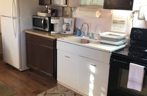 Buchanan Dam Cabin | Cozy Lake Cabin ; private Hot Tub , pool & kayaks possibly shared. We