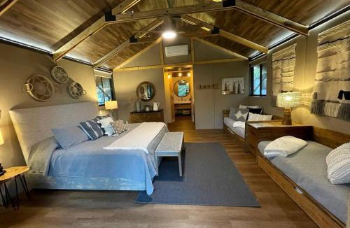 Bastrop House | Cozy Lakefront Glamping Cabin with Private Patio near Austin, Texas