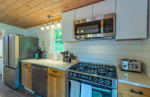 Hiwassee House | Cozy lakefront retreat with private dock, scenic views, updated interiors and serene outdoor seating
