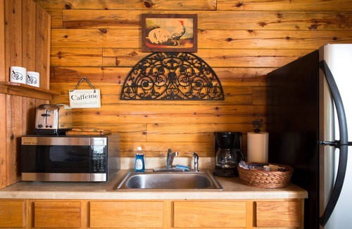Sand Springs Cabin | Cozy Lakeside Log Cabin on a Private Lake. Once stayed by Sir Paul McCartney!