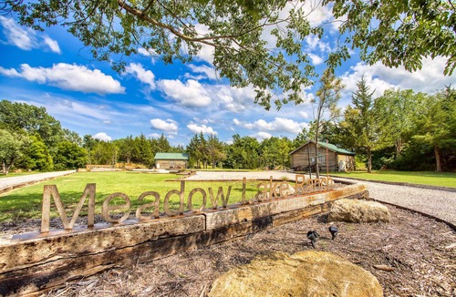 Sand Springs Cabin | Cozy Lakeside Log Cabin on a Private Lake. Once stayed by Sir Paul McCartney!
