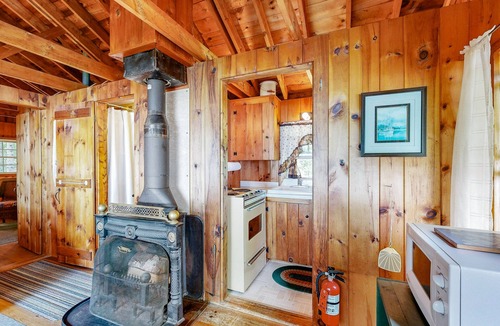 Northport Cabin | Cozy Log Cabin with Deck, Picnic Table & Breath-taking View