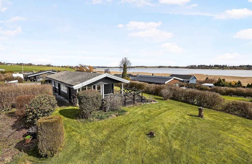 Kirke Saaby House | Cozy log cabin with a view of the water