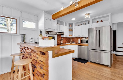 Loring Heights House | Cozy Midtown retreat with skyline views, private yard, deck, firepit, & W/D