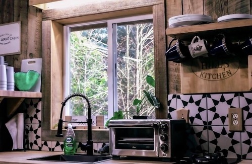 Corning Cabin | Cozy Off-grid Cabin within a private setting loaded with spa like amenities