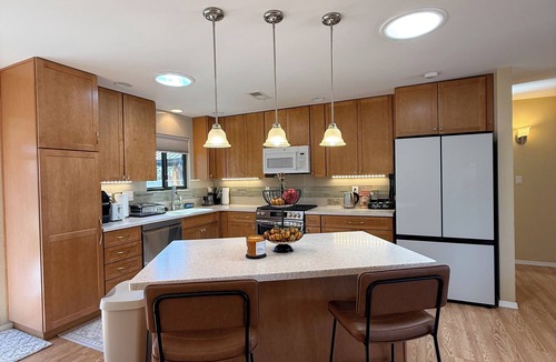 Northeast Heights House | Cozy open concept living with backyard.