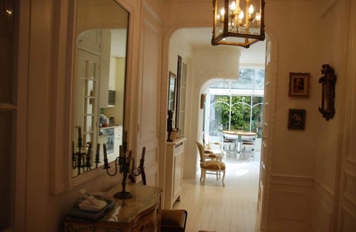 16th Arrondissement Apartment | Cozy Parisian style apartment with a veranda overlooking a private garden.