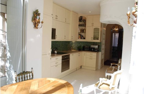 16th Arrondissement Apartment | Cozy Parisian style apartment with a veranda overlooking a private garden.