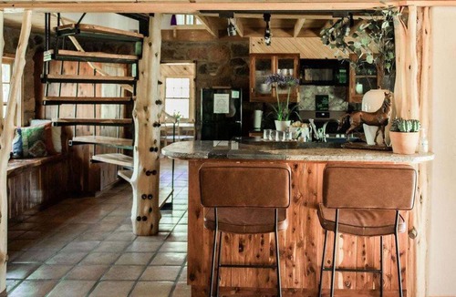 Edmond House | Cozy Route 66 Cabin with Hot Tub - The Gate House — a cozy, beautifully curated retreat in Edmond, OK.