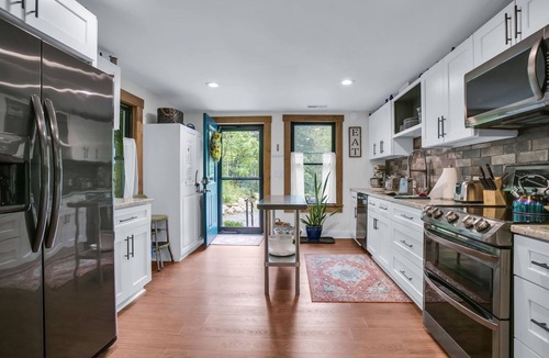 Skyland Cottage | Cozy stone Cottage Pet friendly on Rushing creek porch, soaking tub, & fire-pit