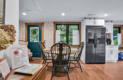 Skyland Cottage | Cozy stone Cottage Pet friendly on Rushing creek porch, soaking tub, & fire-pit