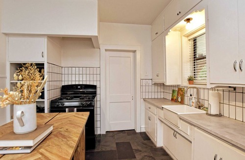 Austin Ave. Condo | Cozy Tudor Bungalow in Waco