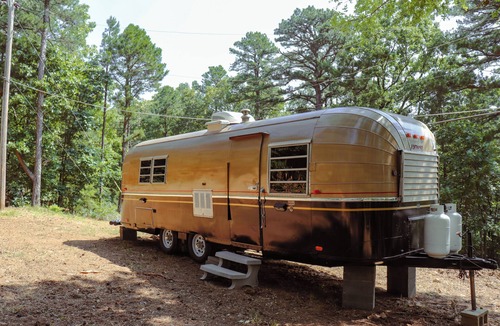 Poteau House | Cozy Vintage Airstream among the pines on World's Highest Hill. Pet-Friendly!
