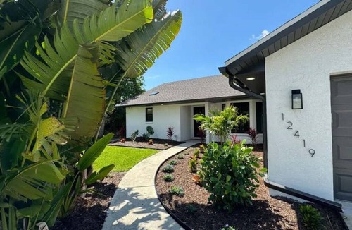 Gulf Cove House | Cozy waterfront retreat with hot tub, deck, and firepit.
