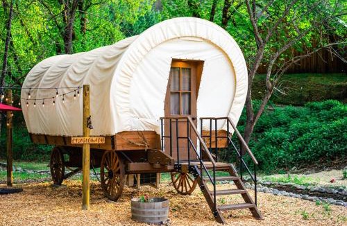 Murphy Other | Cozy Wild West Covered Wagon next to River