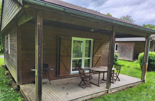 La Chapelle-Taillefert Ski Chalet | Cozy wooden chalets with terrace on forest edge facing a running stream.