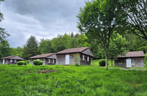 La Chapelle-Taillefert Ski Chalet | Cozy wooden chalets with terrace on forest edge facing a running stream.