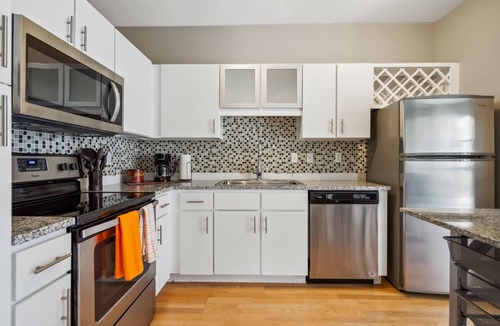Mill District Apartment | CozySuites Mill District with pool, gym #03