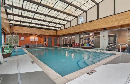 Mill District Apartment | CozySuites Mill District with pool, gym #11