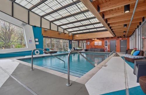 Mill District Apartment | CozySuites Mill District with pool, gym #11