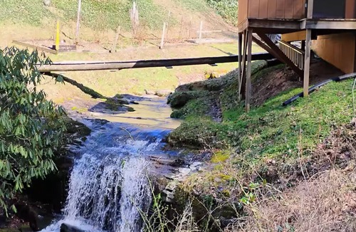 Hartford House | Creekside Mountain Retreat. Waterfall, pond, natural serenity, pet-friendly.