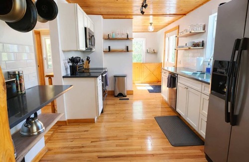 Traverse City Cottage | CreeksideHotTub WalkToBeach Uniquely Northern
