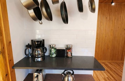 Traverse City Cottage | CreeksideHotTub WalkToBeach Uniquely Northern