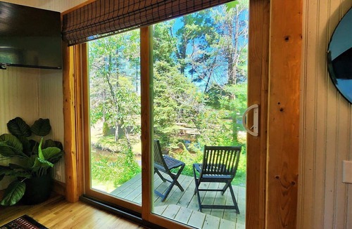 Traverse City Cottage | CreeksideHotTub WalkToBeach Uniquely Northern