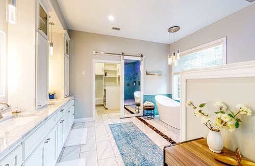 Waller House | Custom Home with Guesthouse, Pond, Swimming Deck, Beach & Tropical Bar