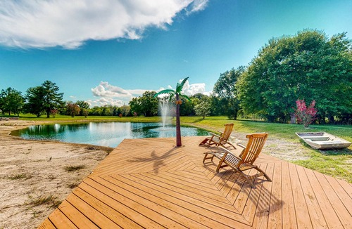 Waller House | Custom Home with Guesthouse, Pond, Swimming Deck, Beach & Tropical Bar