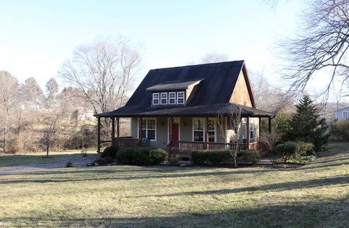Candler House | Cute cottage just outside Asheville with EV charger. Won’t you be my neighbor?