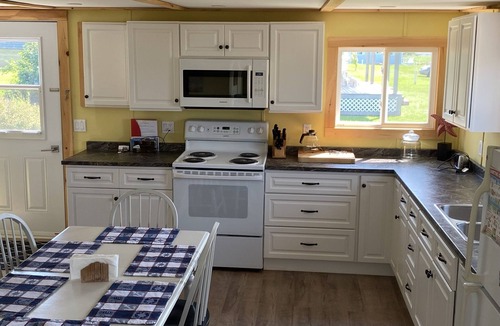 Victoria Cottage | Cute cottage with water view. Steps to a red sand beach on the South Shore.