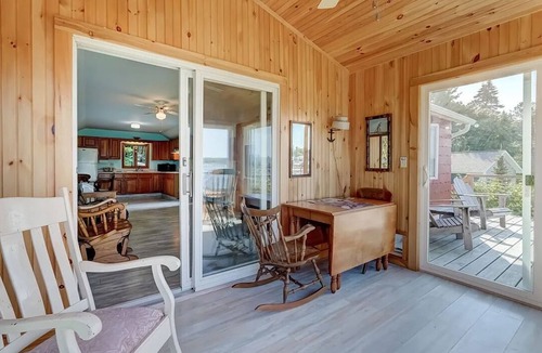 Sodus Point Cottage | Cute red cottage on the hillside overlooking Sodus Bay. Direct water access