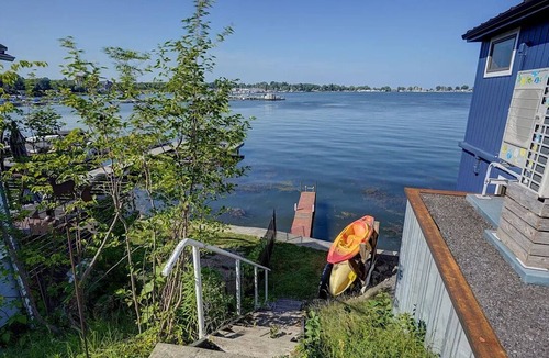 Sodus Point Cottage | Cute red cottage on the hillside overlooking Sodus Bay. Direct water access