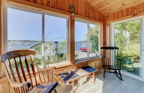 Sodus Point Cottage | Cute red cottage on the hillside overlooking Sodus Bay. Direct water access