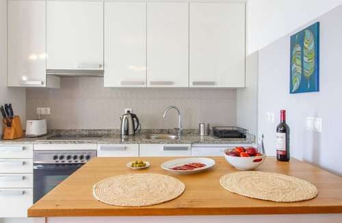 Muchamiel Apartment | Daylight friendly apartment with sea view and shared outdoor pool.