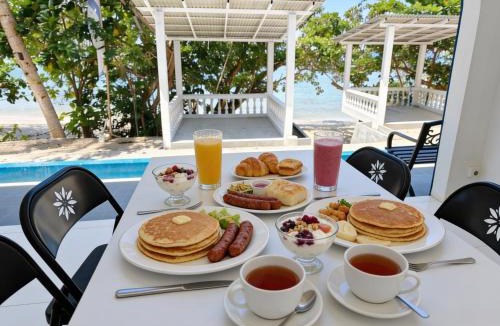 Langowan Resort | De BOUGENVILLE Tulap Beach Front