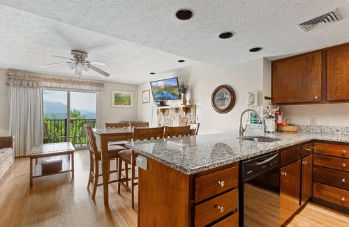 Gatlinburg Condo | Deer Ridge E108 | Balcony, Resort Pools, Tennis + Picnic Area